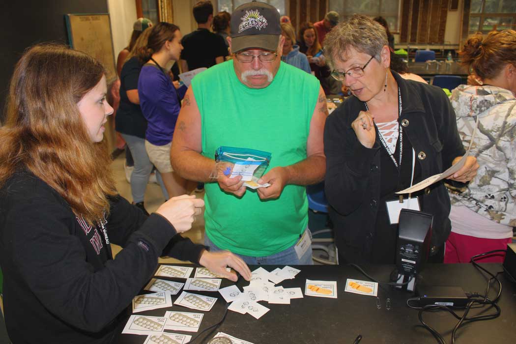 Educator's Ag Institute attendees participate in an ag commodit card game