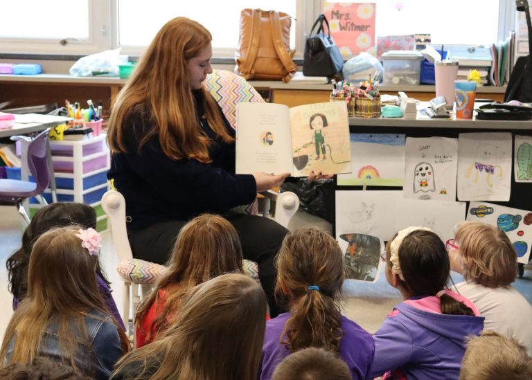FFA student reads Ag Literacy Week book to students
