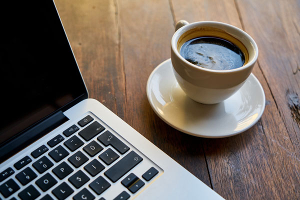 coffee cup and computer